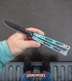 Bear Ops Bear Song IV Cyan Speckle Blue Butterfly Knife - Black -Buck Knives Sales Store Bear Ops Bear Song IV Butterfly Knife Cyan Speckle Blue Black BHQ 83465 kp in hand web large